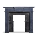 AN IRISH BLUE LIMESTONE FIREPLACE, with frieze pediment on plain column supports,