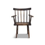A 19TH CENTURY PAINTEDTIMBER CURVED RAILBACK ARMCHAIR, with flat scroll-end integral arm rests,