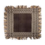 AN IRISH CLADDAGH SHAWL, the central field woven in dark brown, within a cream and brown double