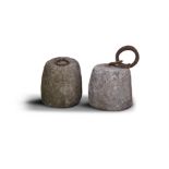 A PAIR OF LIMESTONE WEIGHTS, of barrel form, with iron rings inserted. 39 x 39cm (2)