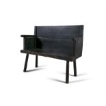 A SHORT PINE SEAT, painted black, plain panel back and seat. 97cm wide, 82cm high