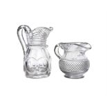 A 19TH CENTURY FLAT-CUT GLASS JUG, the top section and spout cut with reeded decoration and