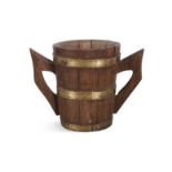 AN OAK PANEL CUP, brass bound with metal handles. 34 (across handles) x 25(h)cm