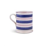 A LARGE HANDPAINTED MUG, decorated with blue and red banding and stepped foot.
