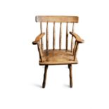 A 19TH CENTURY HEDGE CHAIR, spindle back, integral flat armrests, plain panel seat,