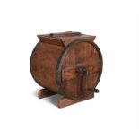 A STAINED PINE BARREL SHAPED MILK CHURN, the panel hinged top, opens to reveal barrel shaped