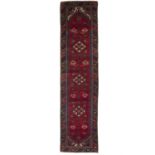 A SEMI-ANTIQUE WOOL RUNNER, CA 1965/70, S.W. TURKEY, 296 x 75cm The central field woven with