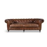 A CHESTERFIELD SOFA, upholstered in button back brown hide, fitted with two loose seat cushions