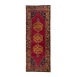 AN OLD WOOL RUNNER, YAHYALI CENTRAL TURKEY, 292 x 111cm the central field woven with three