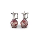 A PAIR OF VICTORIAN BOHEMIAN RUBY FLASHED GLASS CLARET JUGS with silver plated mounts,