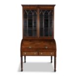 A REGENCY MAHOGANY AND SATINWOOD AND BRASS TRIMMED BUREAU BOOKCASE, POSSIBLY CORK the moulded