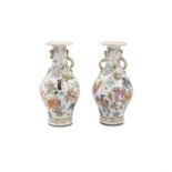 A PAIR OF CHINESE CANTON VASES, 19th Century, each decorated in the traditional colour palette,