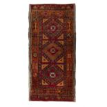 A SEMI-ANTIQUE TURKISH KONYA WOOL RUG, S.W. TURKEY, C.1950, 135 x 65cm The central reserve