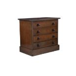 AN EDWARDIAN PINE TABLE CABINET WITH FOUR DRAWERS CONTAINING A COLLECTION OF SPECIMEN MONTHS AND