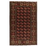 A BROWN GROUND BOKHARA WOOL RUG, TURKMENISTAN, 328 x 212cm the central field woven with eleven