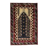 AN OLD KONYA WOOL PRAYER RUG, S.W. TURKEY, C.1970, 208 x 139cm The central field with navy