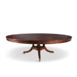 A LARGE GEORGE IV STYLE MAHOGANY CIRCULAR EXTENDING DINING TABLE, 20TH CENTURY, BY ARTHUR BRETT &