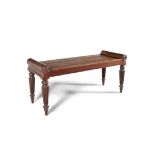 A GEORGE IV MAHOGANY HALL BENCH in the manner of Gillows, with scrolling ends and raised on