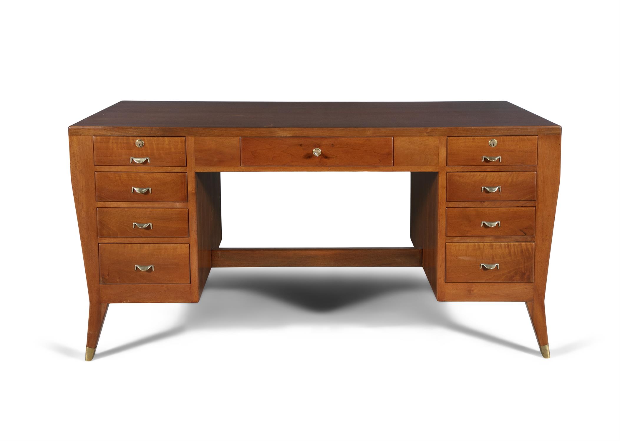 GIO PONTI (1891 - 1979) A walnut desk by Gio Ponti with brass detailing. Italy, c.1954.