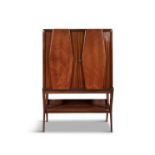 DASSI A mahogany drinks cabinet by Dassi. Double doors with mirror interior and glass shelves.