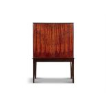 CABINET A rosewood two door cabinet on tapering legs. Denmark, c.1960. 100 x 31 x 151cm(h)