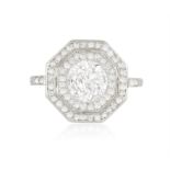 AN EARLY 20TH CENTURY DIAMOND TARGET RING, CIRCA 1920 Of openwork octagonal design,