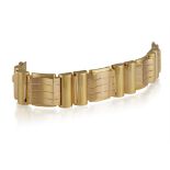 A RETRO GOLD BRACELET, CIRCA 1945 Of tank design, composed of a series of openwork brushed