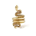 A GOLD SNAKE RING, FRENCH, CIRCA 1960 Designed as a coiling serpent with textured and polished