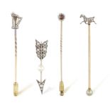 A GROUP OF THREE LATE 19TH CENTURY DIMAOND TIE PINS AND A BROOCH Composed of one pin with a