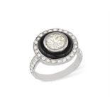 A DIAMOND AND ONYX TARGET RING Centring a brilliant-cut diamond within collet-setting weighing