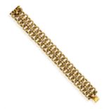 A GOLD BRACELET, FRENCH, CIRCA 1950 Designed as a series of interlocking circular polished and