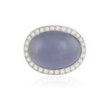A CHALCEDONY AND DIAMOND RING, BY VAN CLEEF & ARPELS The central oval-shaped blue chalcedony