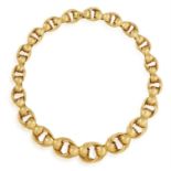 A RETRO GOLD NECKLACE, BY MARCHISIO, CIRCA 1940 Designed as a series of graduated circular