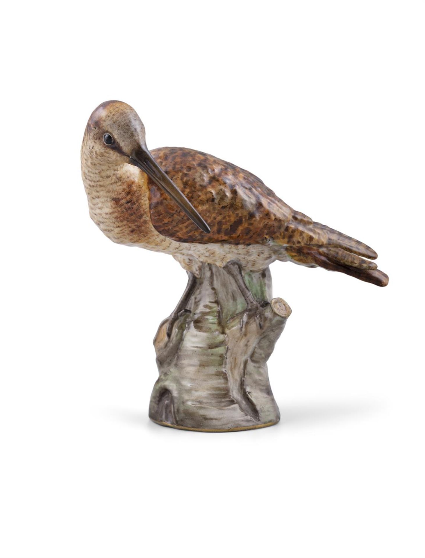 AN EARLY 19TH CENTURY MEISSEN PAINTED PORCELAIN MODEL OF A SNIPE standing by a tree trunk with