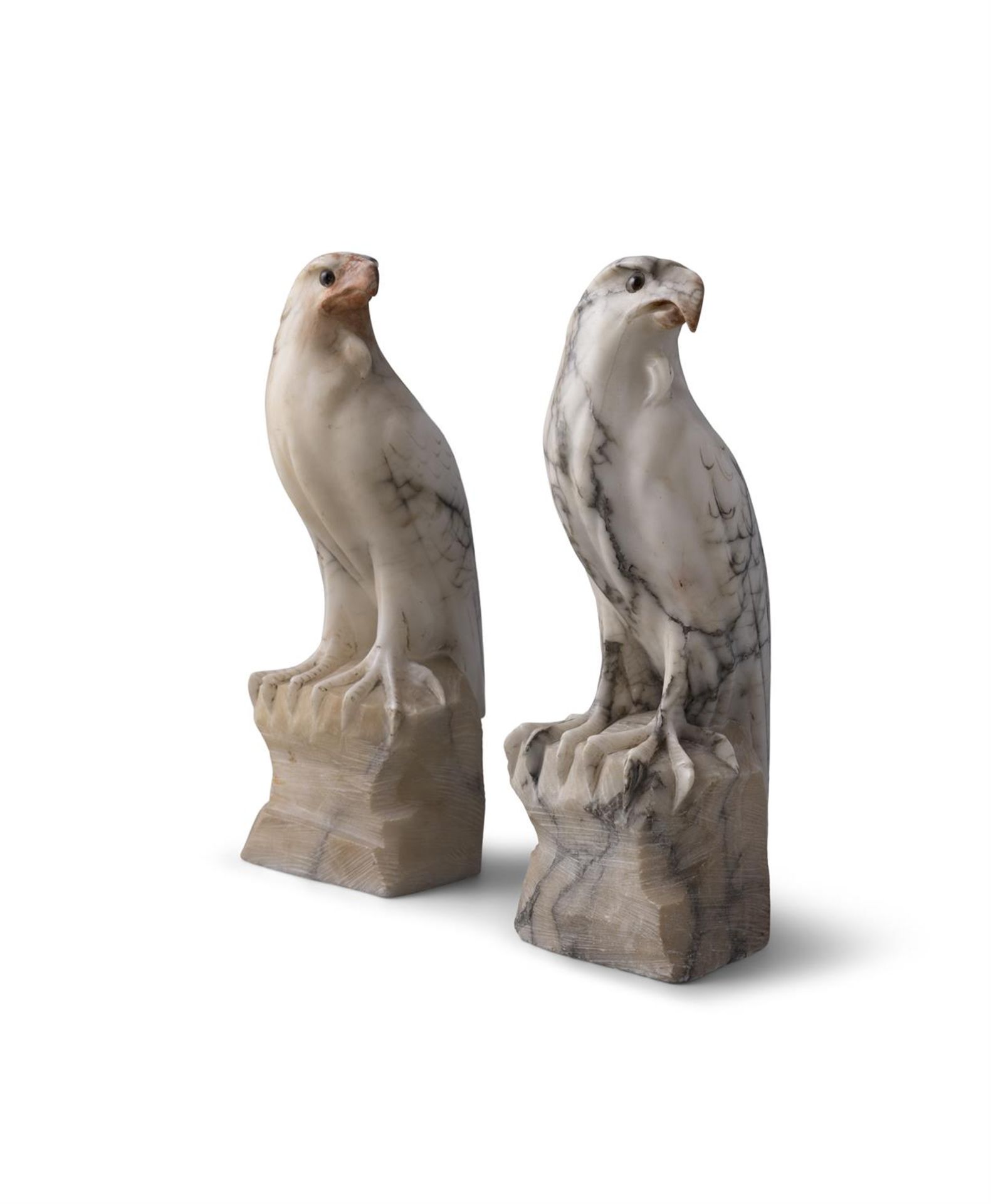 A PAIR OF CARVED WHITE VARIEGATED MARBLE MODELS OF HAWKS PERCHED ON ROCKY OUTCROPS. 31cm high - Image 3 of 4