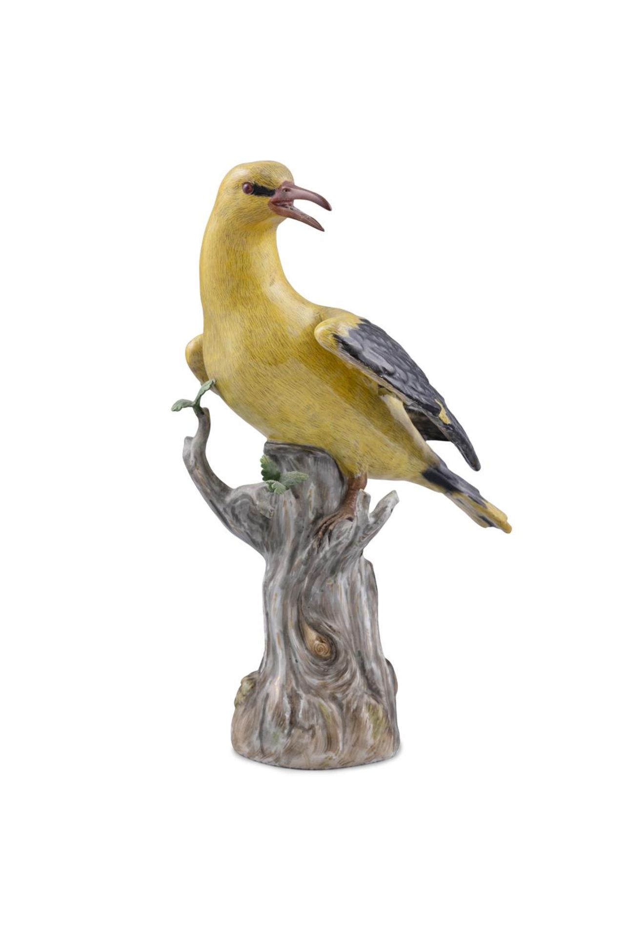 A 19TH CENTURY MEISSEN PAINTED PORCELAIN MODEL OF A GOLDEN ORIOLE, standing on a tree trunk with