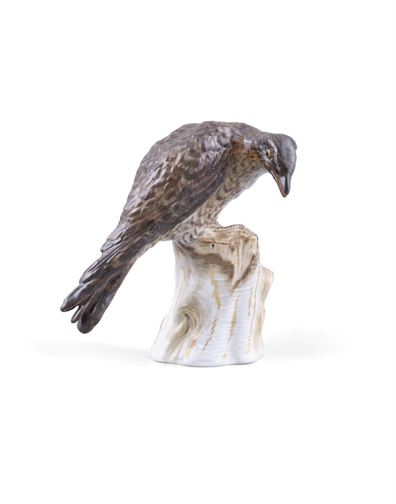 A 19TH CENTURY MEISSEN PAINTED PORCELAIN MODEL OF A SPARROW HAWK on a tree stump,