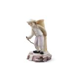 A BELLEEK CHINA 1ST PERIOD FIGURE OF A BELGIAN HAWKER, with a basket on his back holding a staff,