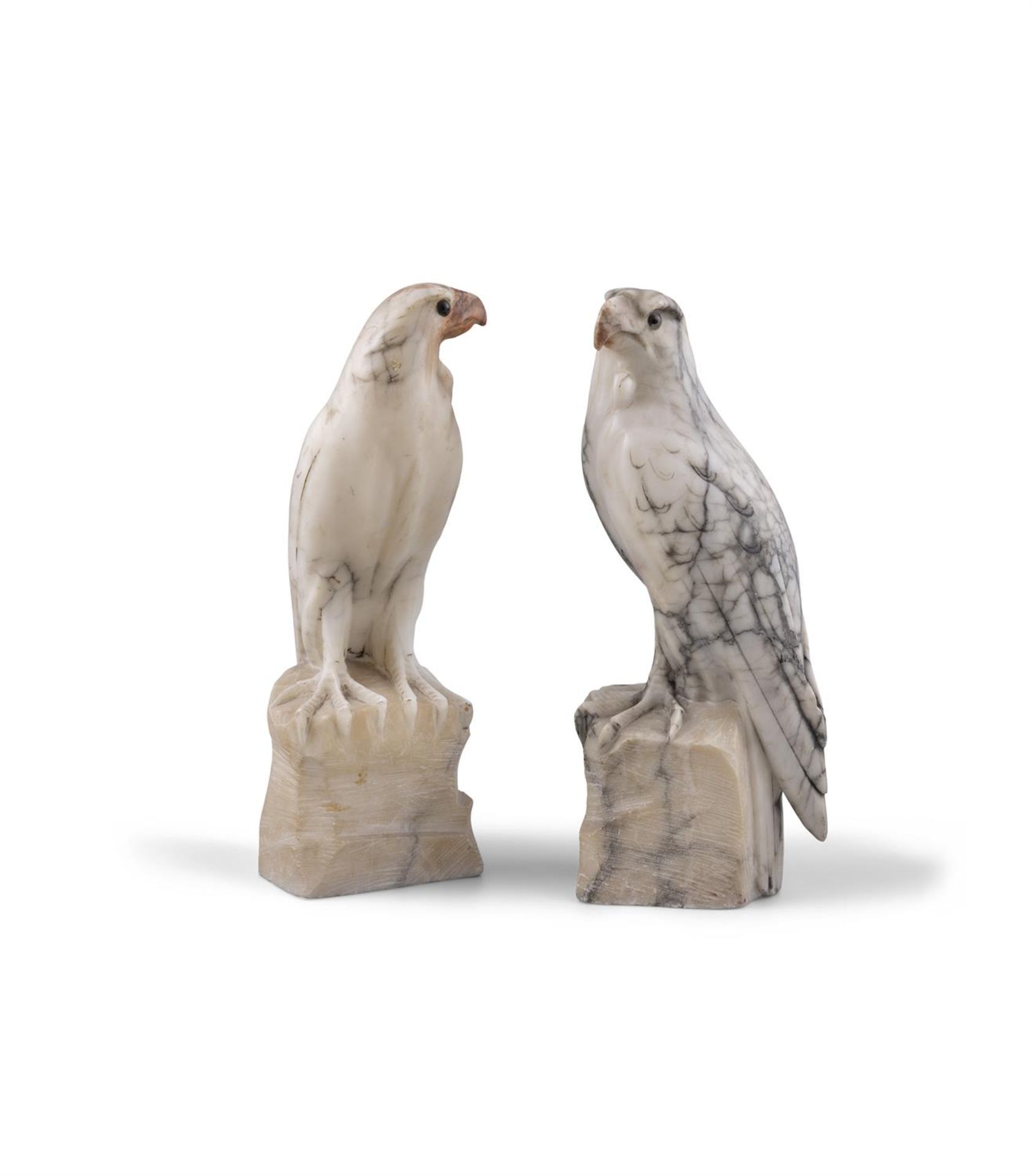 A PAIR OF CARVED WHITE VARIEGATED MARBLE MODELS OF HAWKS PERCHED ON ROCKY OUTCROPS. 31cm high - Image 2 of 4