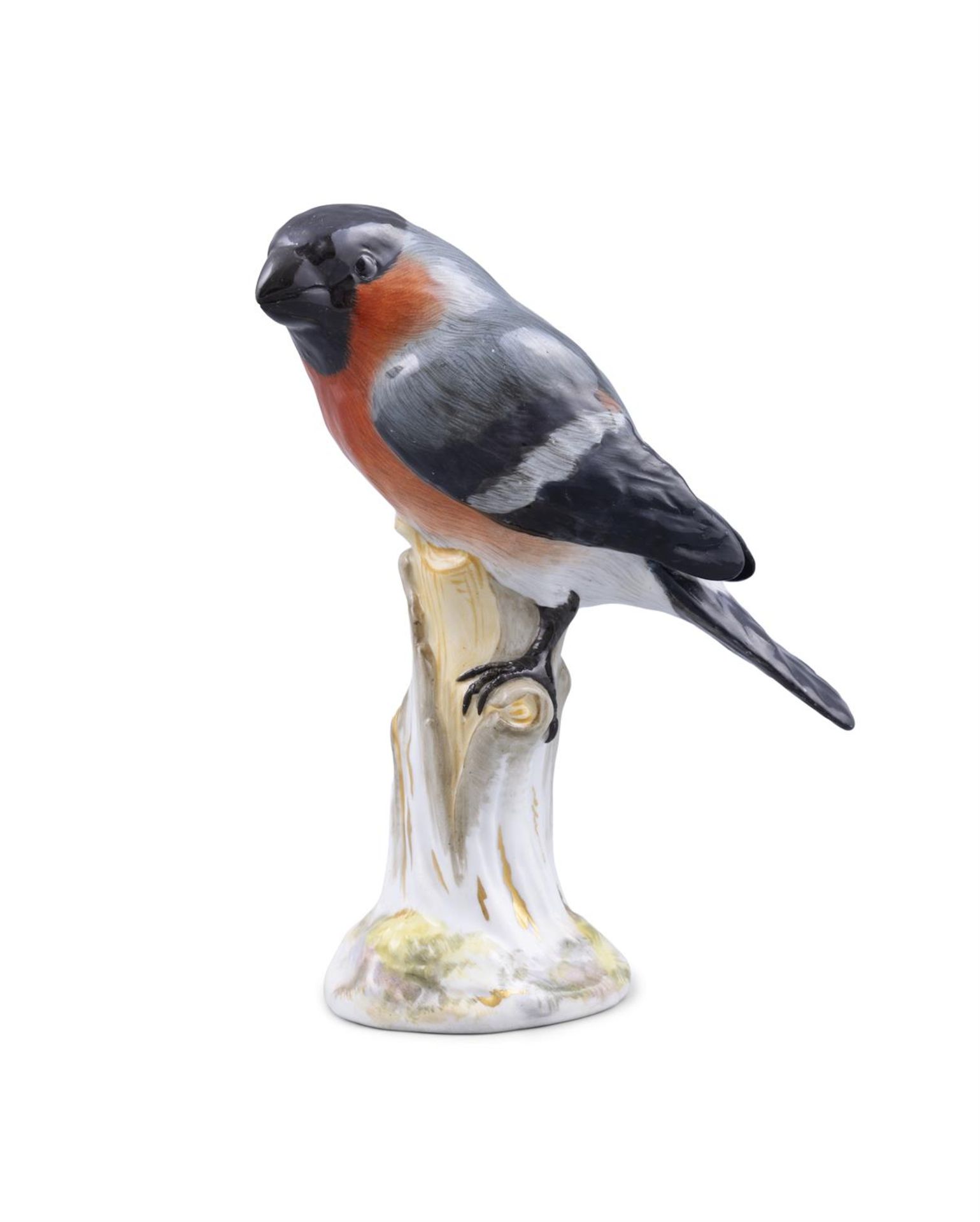 A 19TH CENTURY MEISSEN PAINTED PORCELAIN MODEL OF A BULLFINCH standing on a tree stump hand