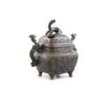 A SMALL JAPANESE BRONZE KORO AND COVER Meiji Period, the domed cover pierced, with animal finial,