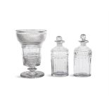 A PAIR OF OLD IRISH CUT GLASS OVAL OIL BOTTLES with facetted bodies and diamond banding,