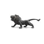 A LATE 19TH CENTURY SPELTER MODEL OF A RAMPANT LION 61cm long