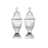 A PAIR OF 19TH CENTURY CUT GLASS COVERED URNS OF CIRCULAR FORM with facet and diamond cut