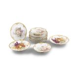 A 'KPM' HAND PAINTED PORCELAIN DESSERT SERVICE comprising a set of eight plates and two pairs of