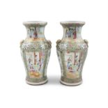 A PAIR OF CHINESE CANTON VASES, QING DYNASTY (1644 - 1912) of baluster form, decorated in usual