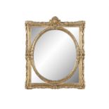 A 19TH CENTURY GILTWOOD AND GESSO COMPARTMENTAL MIRROR, a framed oval glass plate contained