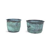 TWO LARGE HAMMERED COPPER POTS each pot with turnover rims. The largest 51cm diameter