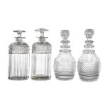 ***PLEASE NOTE THERE ARE ONLY FOUR DECANTERS IN THIS LOT*** TWO SIMILAR CUT-GLASS CASE DECANTERS