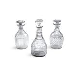 THREE CUT GLASS DECANTERS The largest example with flat-cut decoration, the other two with